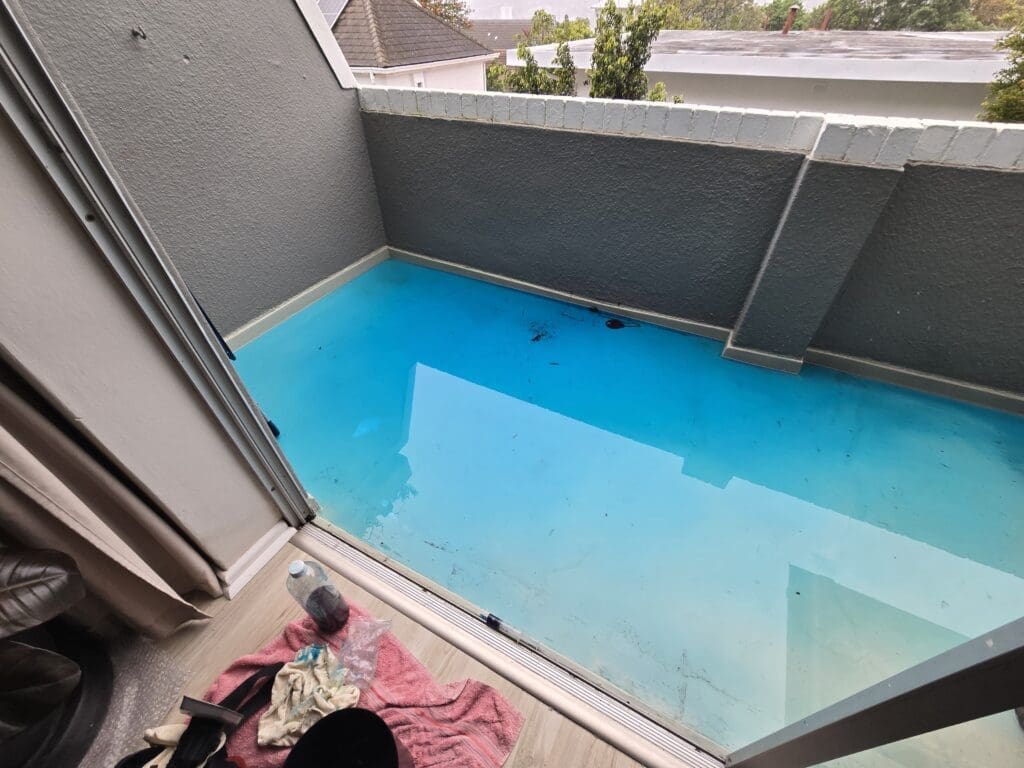 Leak detection flood test using of a balcony using UV dye solution
